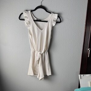 Caution To The Wind Cream Ruffle Jumpsuit